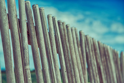 Close-up of wooden fence against sky