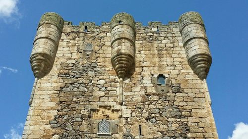 Low angle view of fort against blue sky