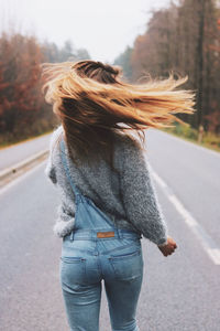 Rear view of woman on street