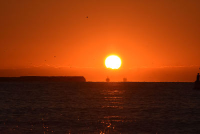 Scenic view of sunset over sea