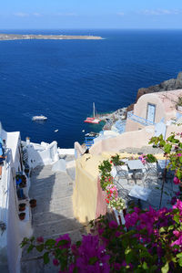 High angle view of buildings by sea against sky