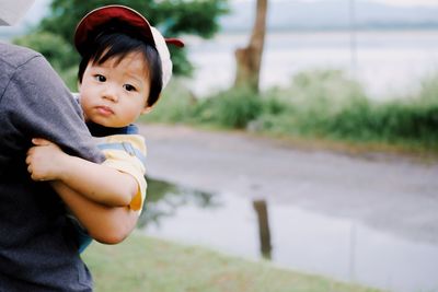 Portrait of cute boy standing outdoors