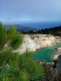 High angle view of a lake and trees against sky