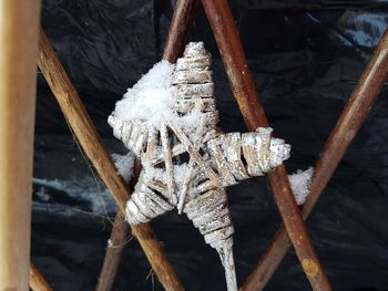 High angle view of rope tied to wooden post in winter