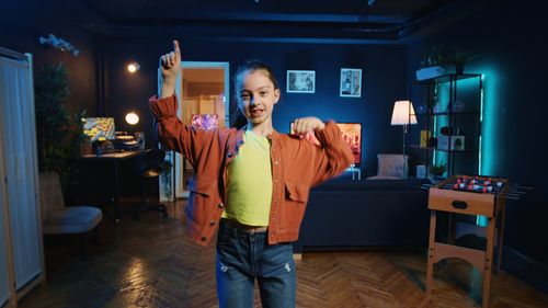 Portrait of young woman standing in store