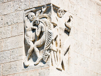 Low angle view of carving on wall