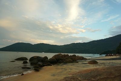 Scenic view of sea against cloudy sky