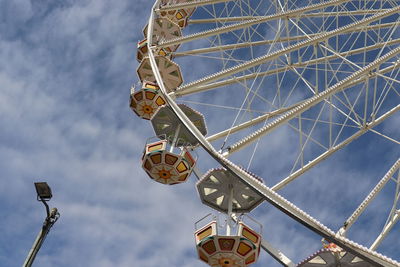 Low angle view of ferris wheel against sky