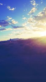 Scenic view of landscape against cloudy sky