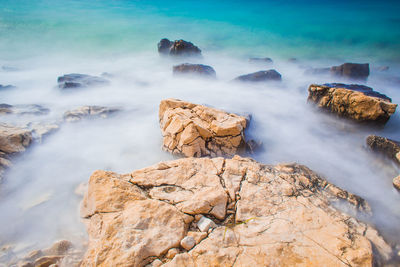 Scenic view of rocks in sea