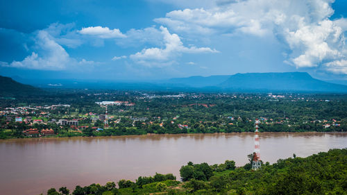 Aerial view of city and buildings against sky