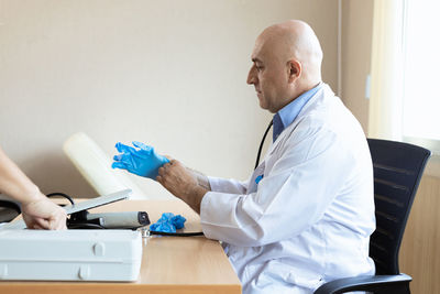 Doctor examining patient at clinic