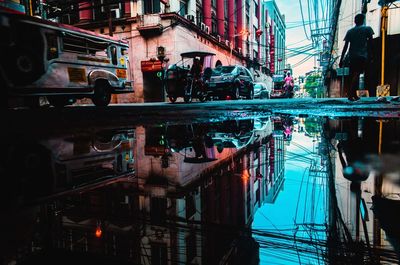 Reflection of buildings in puddle