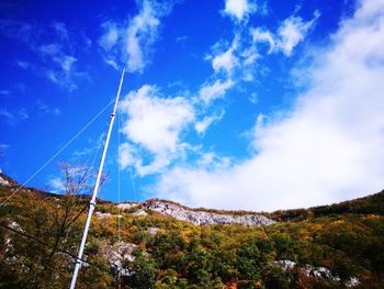 Low angle view of vapor trail against blue sky