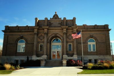 Exterior of library against clear blue sky