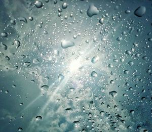 Full frame shot of raindrops on glass window