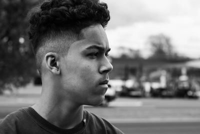 Side view of young man looking away