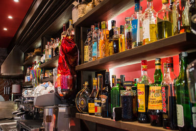 Panoramic shot of bottles on display