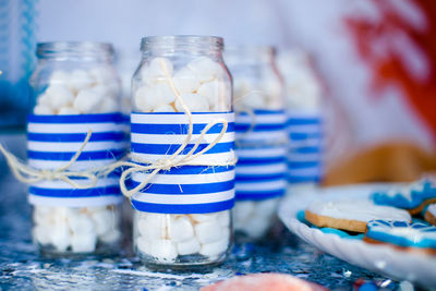 Close-up of drink in glass jar on table