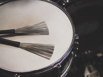 Close-up of broom on drum