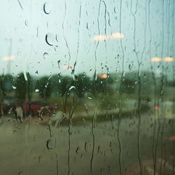 Raindrops on glass window during rainy season