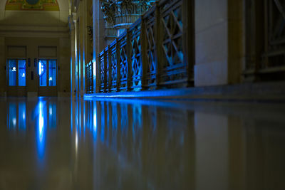 Reflection of illuminated building in lake at night