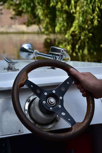 Close-up of hand holding boat