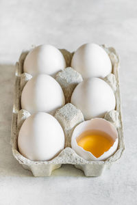 Directly above shot of eggs in carton on table