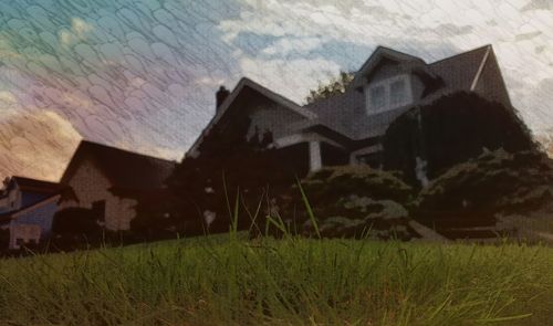 View of grassy field against sky