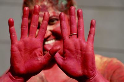 Close-up portrait of smiling woman covered with powder paint