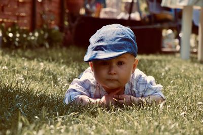 Portrait of cute boy on field