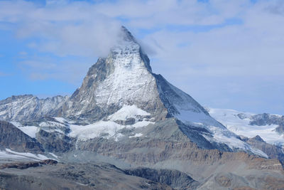 Scenic view of snowcapped mountain against sky