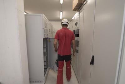 Portrait of young man standing in bathroom