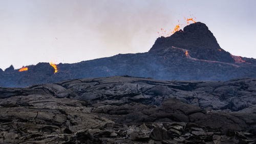 Rock formation on mountain against sky