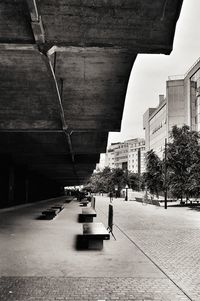 Cars on street by buildings in city