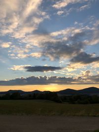 Scenic view of silhouette landscape against sky during sunset