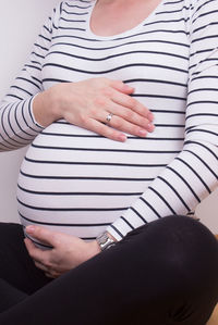 Low section of woman sitting on floor