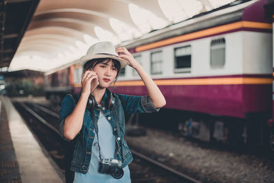 Young woman in train at railroad station