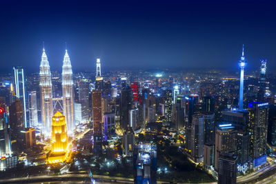 Illuminated buildings in city at night