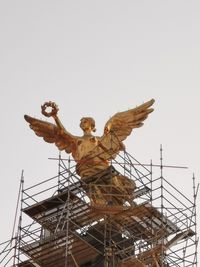 Low angle view of statue against clear sky