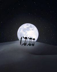 Digital composite image of silhouette man and camels against moon at desert