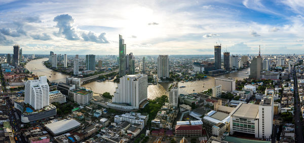High angle view of modern buildings in city against sky