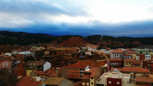 High angle view of town against cloudy sky