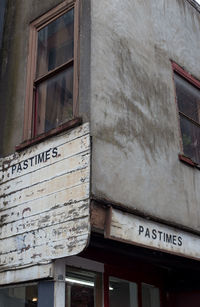 Low angle view of text on building