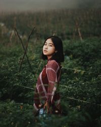 Girl looking away on field