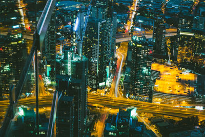 Aerial view of illuminated city at night