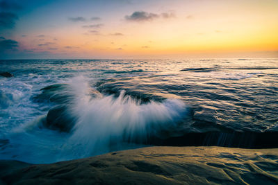 Scenic view of sea at sunset