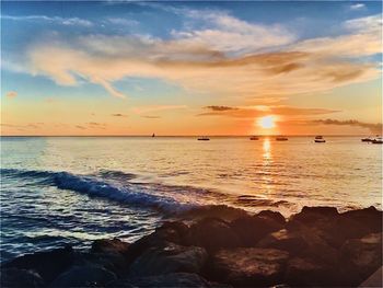 Scenic view of sea against sky during sunset