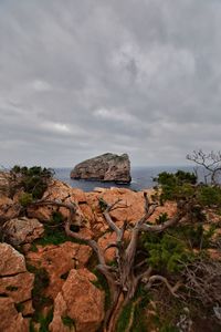 Rock formations on mountain against sky