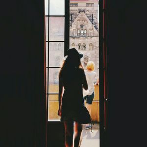 Woman standing by railing